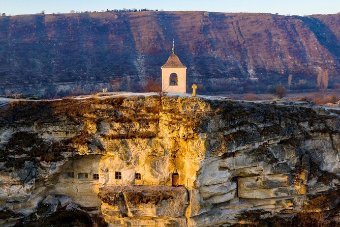 Authentic Moldova - Excursion to Orhei Vechi - Curchi Monastery in the Codru area: white and red walls with a forest setting